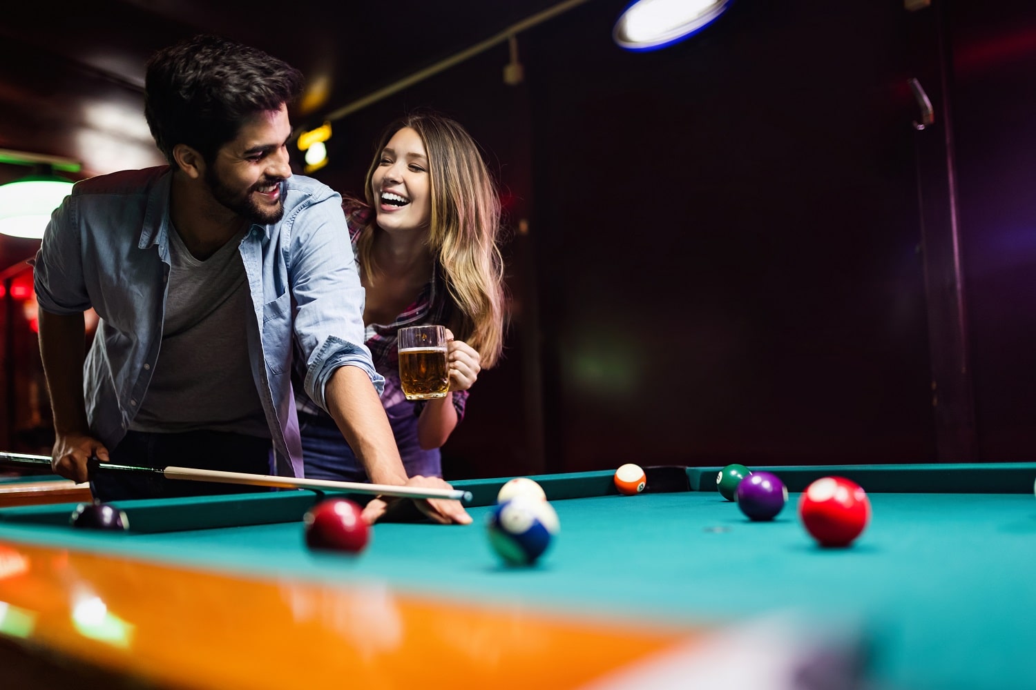 About 1 Couple Having Fun Playing Billiard